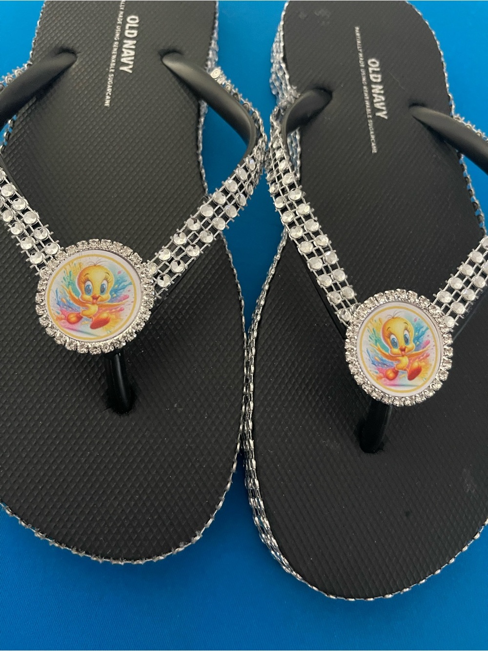 Old Navy Black Rhinestone Flip Flops with Colorful Tweety Medallions